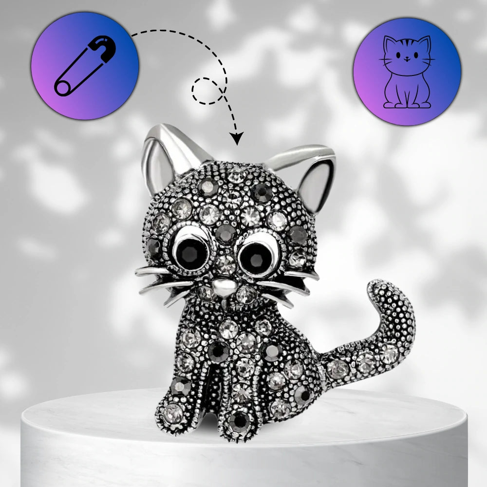 Elegantiška juoda katės sagė, dekoruota cirkoniais