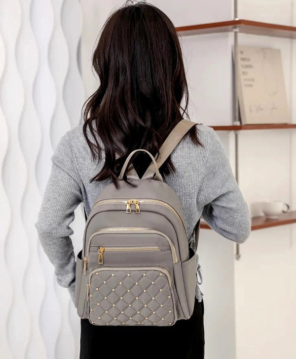 Neperšlampama kuprinė moterims, pilka