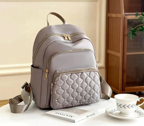 Neperšlampama kuprinė moterims, pilka