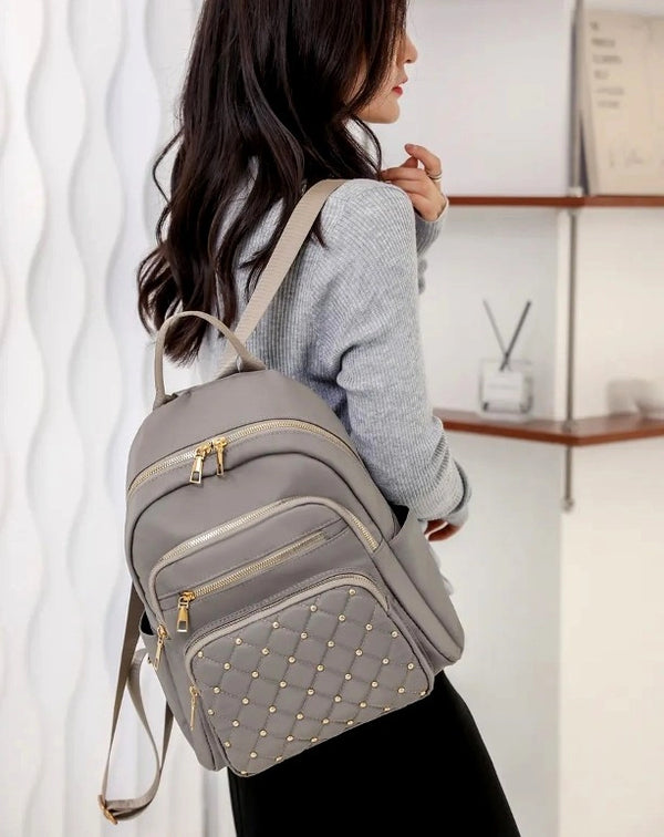 Neperšlampama kuprinė moterims, pilka