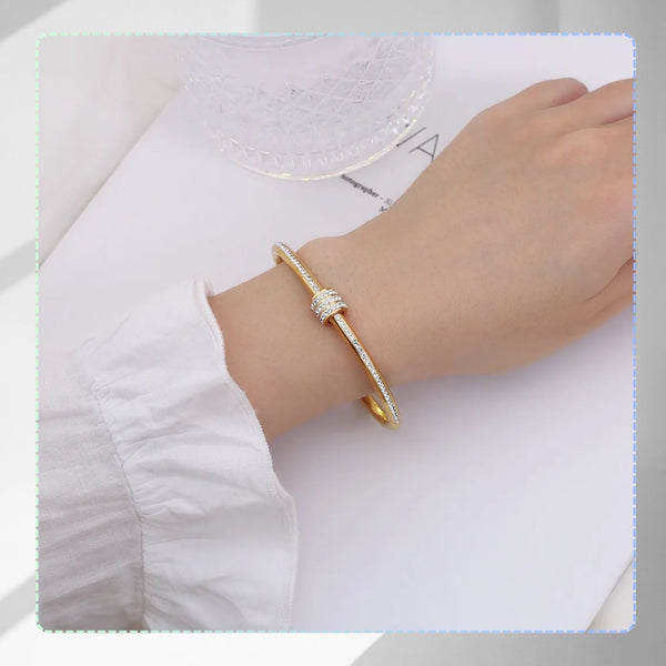 Auksinė standi apyrankė su cirkoniais