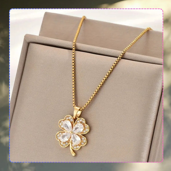 Auksinis vėrinys su cirkoniais ir keturlape dobele, chirurginis plienas