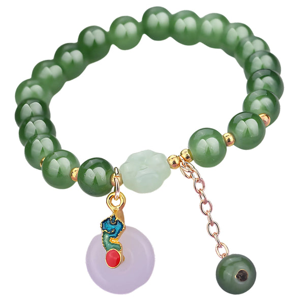 Žalia apyrankė su karoliukais ir pakabuku