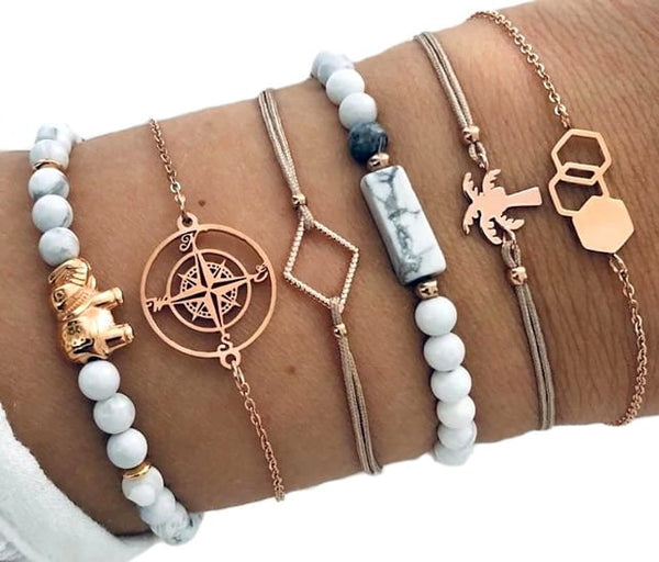 6 auksinių ir kreminių apyrankių rinkinys su drambliu ir palme